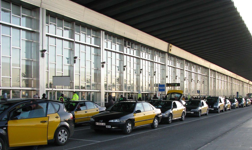 Row of taxis waiting at Barcelona-El Prat Airport terminal